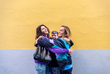 Young diverse friends talking outdoors on the street.