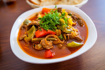 Lagman with noodles, meat and vegetables in an Uzbek restaurant.