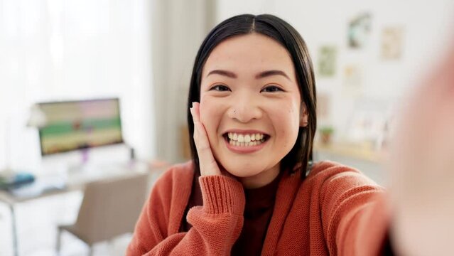 Happy influencer, face or live streaming selfie of home office for social media app, content vlog or interior design blog. Smile, portrait or talking asian woman in wave for internet channel audience
