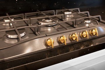 closeup of brand new, modern gas stove on countertop in contemporary modern home kitchen.