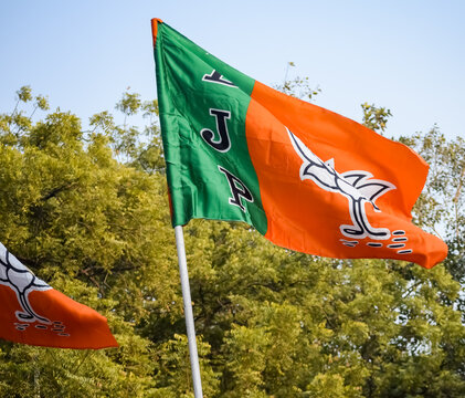 Bharatiya Janata Party Flag of Indian political party, BJP Bhartiya Janta Party Flag Waving during PM road show in Delhi, India