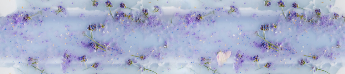 Seamless floral pattern with blooming lavender stems and flowers in blue foamy water with oils. Generative AI