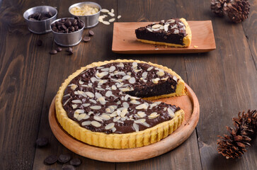Homemade Chocolate pie isolated on wooden background