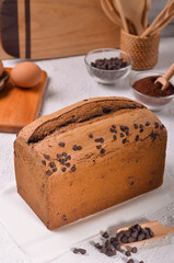 Tasty Handmade Chocolate chip pillow loaf cake isolated on wooden background
