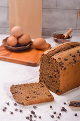 Tasty Handmade Chocolate chip pillow loaf cake isolated on wooden background