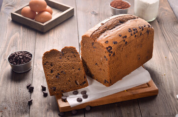 Tasty Handmade Chocolate chip pillow loaf cake isolated on wooden background