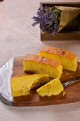 Homemade sponge cake or chiffon cake on wooden plate so soft and delicious with ingredients: eggs,...
