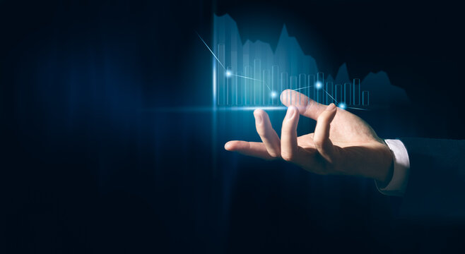 Businessman planning and strateg holding digital data growth graph and progress of business and analyzing financial and investment information.