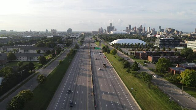 Vehicles Driving At Interstate 75 (I-75), With The Detroit Skyline And Lexus Velodrome In Michigan, USA. - aerial