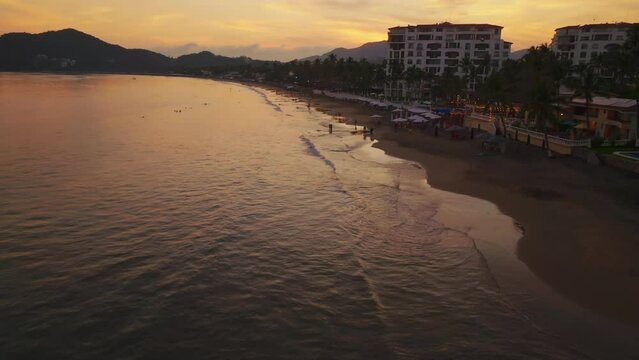 Aerial Drone View Of Playa Delfos, Club Santiago In Manzanillo, Colima, Mexico During Sunset.