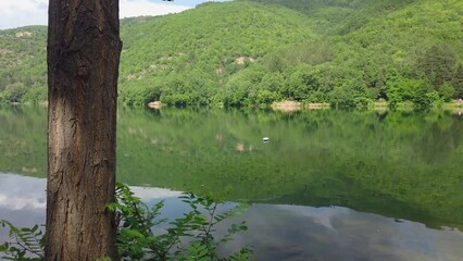 DO NOT LITTER sign near a mountain lake, anti enviroment pollution concept