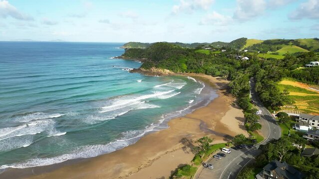 Aerial shot of Ngunguru Bay, Beautiful beach with green lands, Matapouri area | New Zealand North Island.