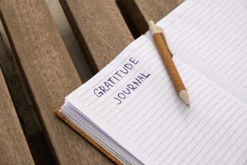 Writing Gratitude Journal on wooden bench. Today I am grateful for. Self discovery journal, self...
