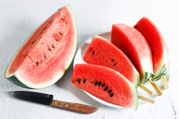 Watermelon slices with stick.