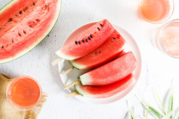Watermelon slices with stick.