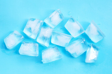 Ice cubes on blue background.