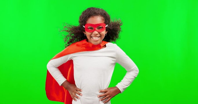 Portrait, justice and children with a superhero girl on a green screen background in studio standing hands on hips. Kids, costume and a happy female child hero playing fantasy as a crime fighter