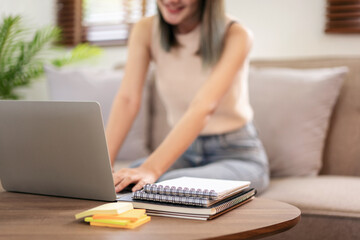 Female fashion artist sitting on the comfortable sofa to working