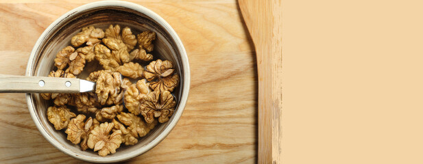 Walnuts are covered with water in a clay bowl. Veganism and vegetarianism. Banner concept, copy space
