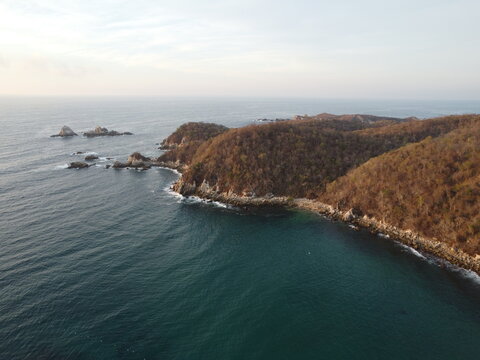 4k drone photo panoramic view of the coast of oaxaca, huatulco, mexico blue sea, summer holidays waves sunset