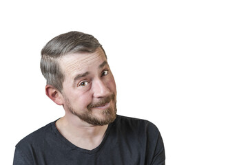 Fototapeta premium Portrait of an attractive bearded man of European appearance, with a slight gray hair, on an isolated white background. Naive facial expression. Expression of emotions of a man.