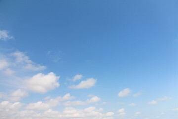 Blue sky background with white clouds.	 - 586444061
