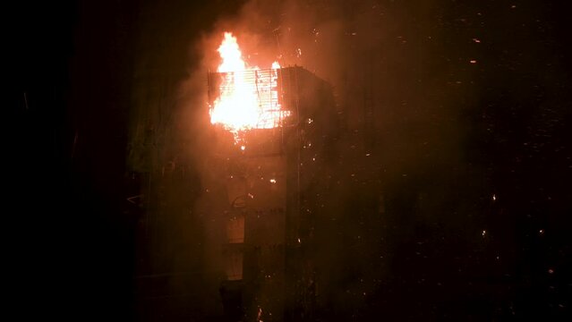 Close view of flames of a fire incident affecting a high rise skyscraper office building in Hong Kong.