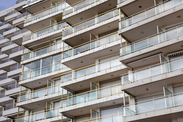 facade apartment building with glass balconies in modern architecture houses large glazing balcony