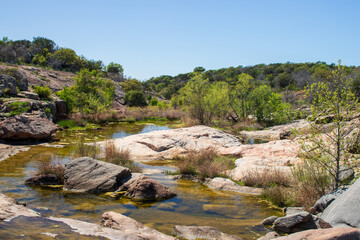 A stream known as Spring Creek flows over the sandstone formations on a beautiful spring day in the...