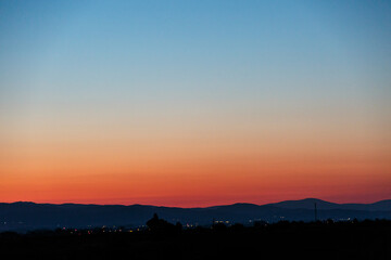 Sunrise over the land with hills