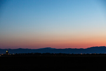 Sunrise over the land with hills