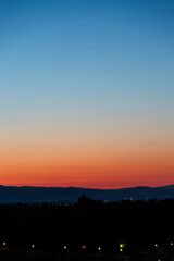 Fototapeta premium Sunrise over the land with hills