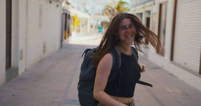 Hiker girl happy walking to the beach