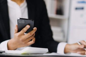 Financial analysts analyze business financial reports on a digital tablet planning investment project during a discussion at a meeting of corporate showing the results of their successful teamwork.