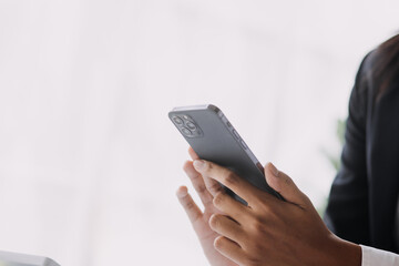 Financial analysts analyze business financial reports on a digital tablet planning investment project during a discussion at a meeting of corporate showing the results of their successful teamwork.