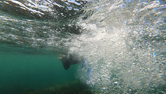 Dive into the mesmerizing world of the ocean with this thrilling follow cam of a snorkeler.