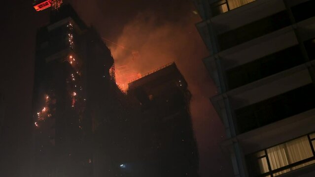 A large and uncontrollable fire incident breaks out in a skyscraper building.