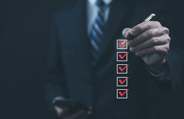 Businessman ticking a red checkmark on a box in the list. Checklist Ideas in Business Survey items...