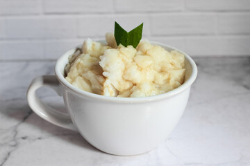 Bubur sumsum. Dessert porridge originating from Java made from rice flour, coconut milk with palm sugar syrup. Popular food during Ramadan. Bubur sumsum is a traditional food from Java