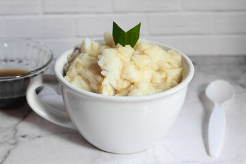 Bubur sumsum. Dessert porridge originating from Java made from rice flour, coconut milk with palm sugar syrup. Popular food during Ramadan. Bubur sumsum is a traditional food from Java