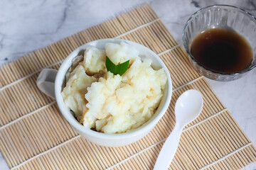 Bubur sumsum. Dessert porridge originating from Java made from rice flour, coconut milk with palm sugar syrup. Popular food during Ramadan. Bubur sumsum is a traditional food from Java