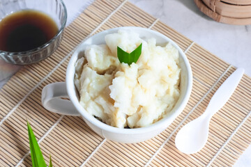 Bubur sumsum. Dessert porridge originating from Java made from rice flour, coconut milk with palm sugar syrup. Popular food during Ramadan. Bubur sumsum is a traditional food from Java