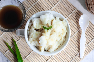 Bubur sumsum. Dessert porridge originating from Java made from rice flour, coconut milk with palm sugar syrup. Popular food during Ramadan. Bubur sumsum is a traditional food from Java