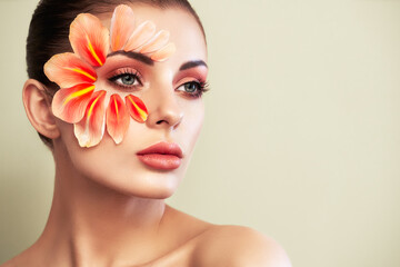 Portrait of beautiful young woman with makeup petals. Brunette woman with luxury makeup. Perfect skin. Eyelashes. Cosmetic eyeshadow - obrazy, fototapety, plakaty