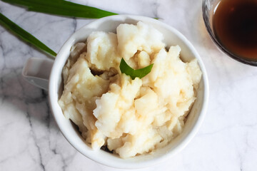 Bubur sumsum. Dessert porridge originating from Java made from rice flour, coconut milk with palm sugar syrup. Popular food during Ramadan. Bubur sumsum is a traditional food from Java