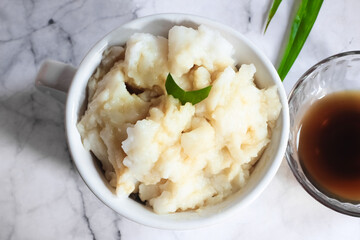 Bubur sumsum. Dessert porridge originating from Java made from rice flour, coconut milk with palm sugar syrup. Popular food during Ramadan. Bubur sumsum is a traditional food from Java