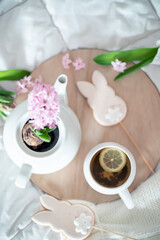 Custard pot, flowers, Easter eggs and gingerbread in the form of Easter bunnies