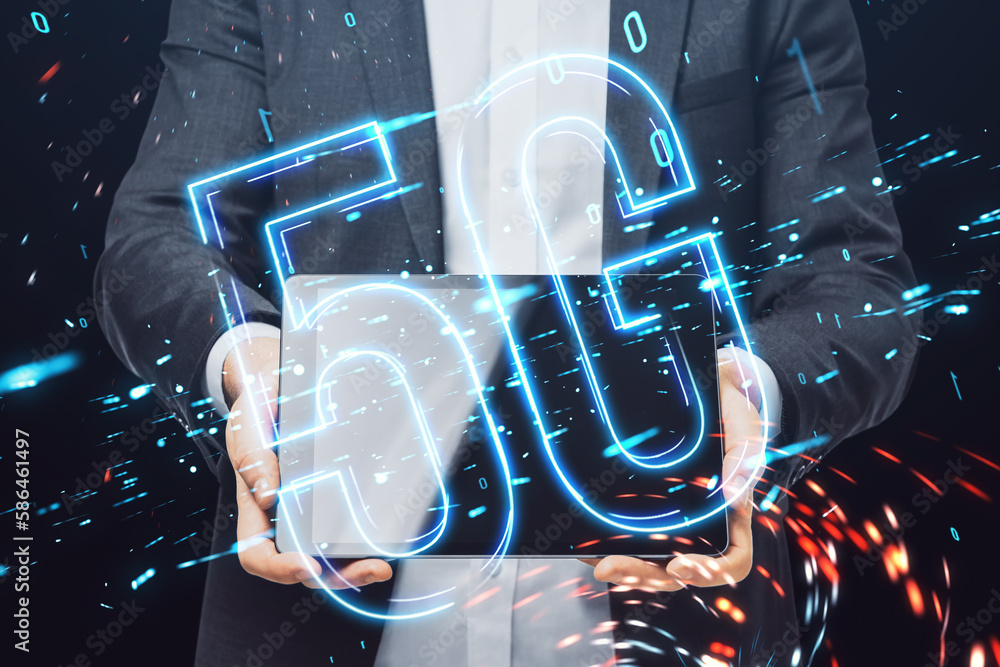 Poster close up of businessman hands holding tablet with glowing 5g hologram on blurry dark background. int