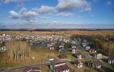Aerial photo of scientific cottage village Sigma. Beautiful autumn country landscape from above. Novosibirsk, Siberia, Russia