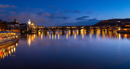 Prague nightscape with the city skyline, landmark buildings, old town towers, and Charles Bridge over the Vltava River Czech Republic